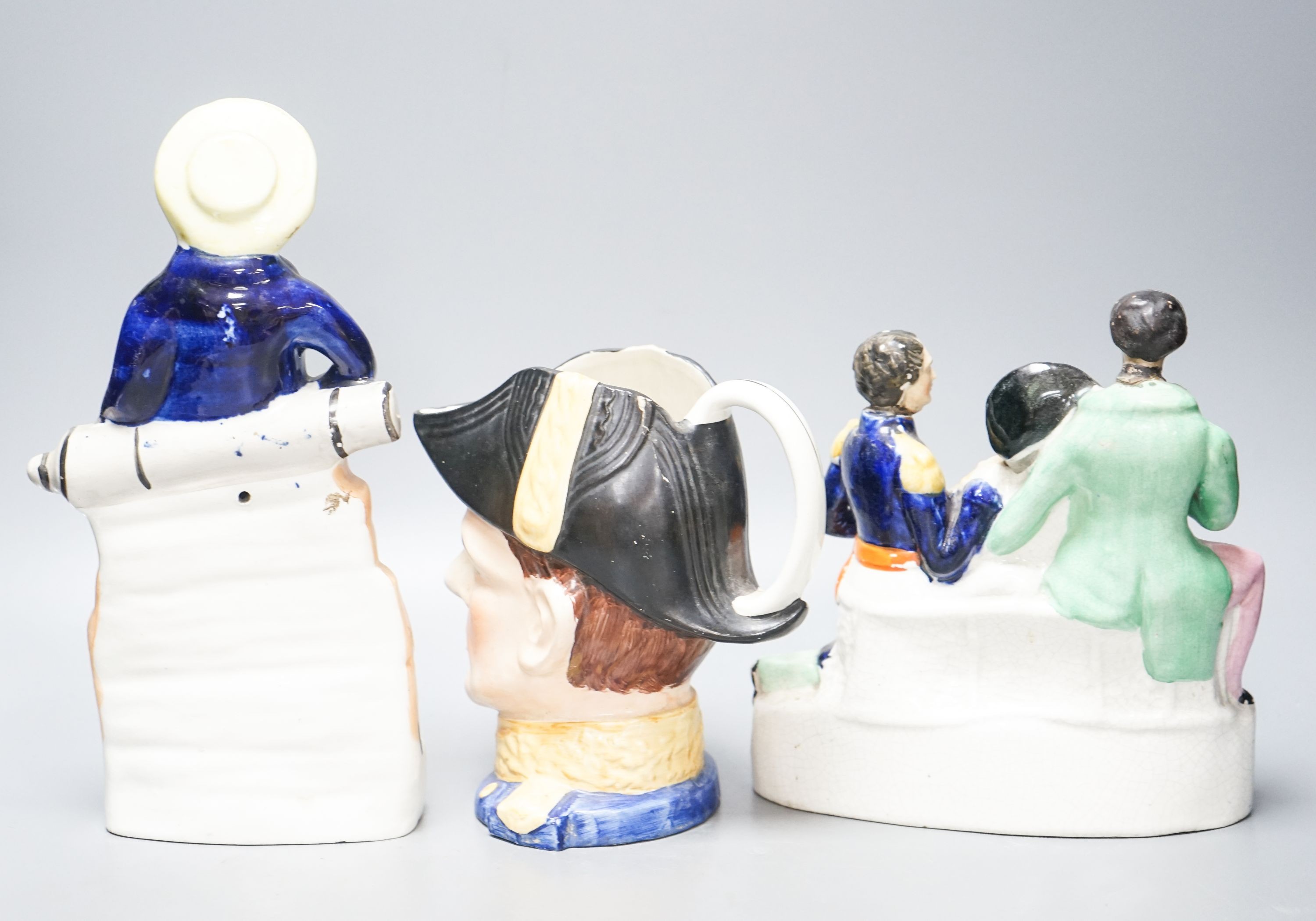 A Victorian Staffordshire 'Death of Nelson' group, a 'Britain’s Glory' figure and a character jug 27cm